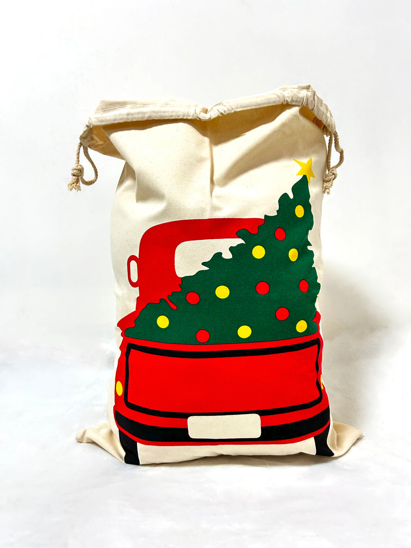 Picking up tree Christmas gift bag